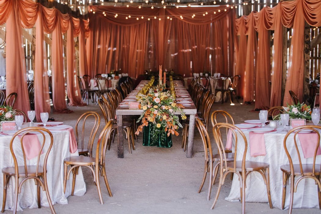 Loma Grande Ranch Terracotta draping around barn and on barn door. Draping by: Draping by Kim and photography by Nikkels Photography