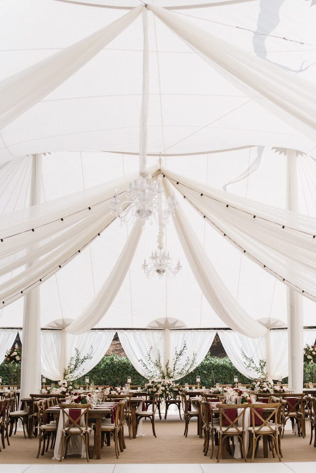 Sheer ivory draped in tent using a starburst and cabana style drape. Draping and lighting by Draping by Kim